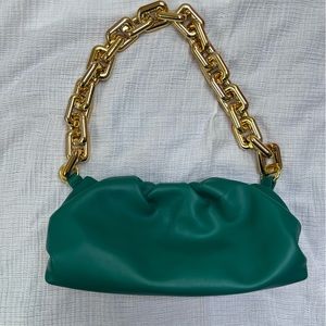 Green clutch with chunky gold handle